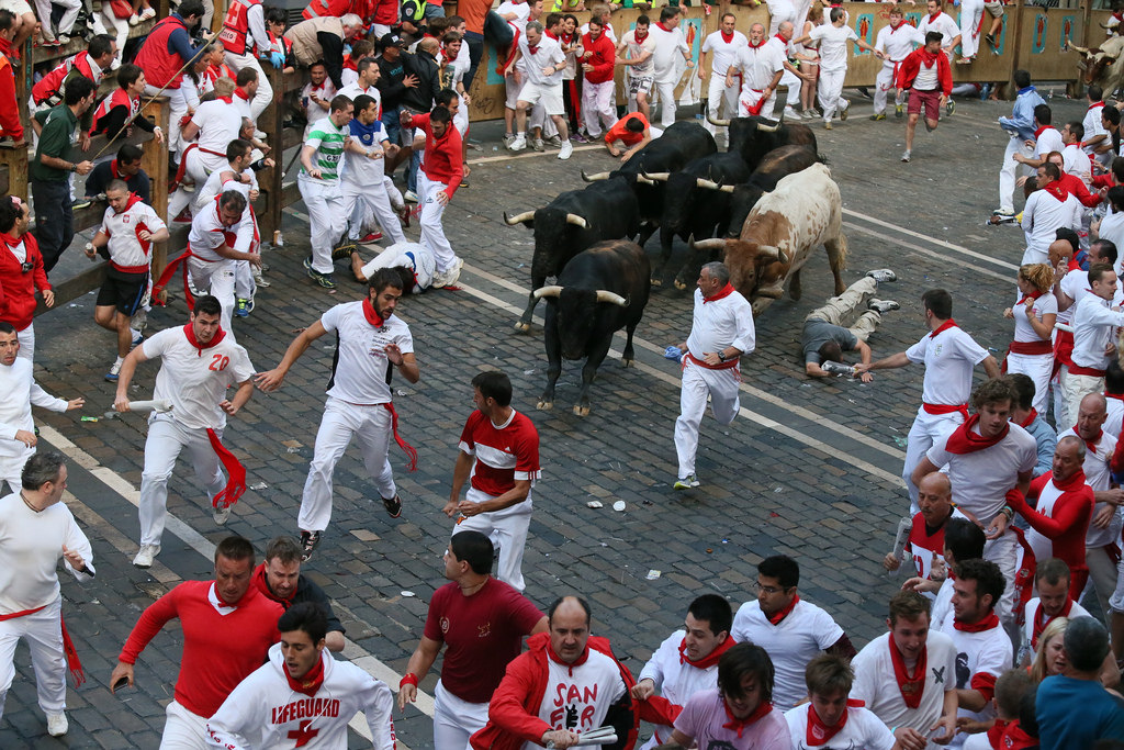 San Fermin Festivities. Typical Scene Of The Street During The San Fermin.  The Red Scarf Is A Distinctive Element. Pamplona, Spain. Stock Photo,  Picture and Royalty Free Image. Image 14667841.